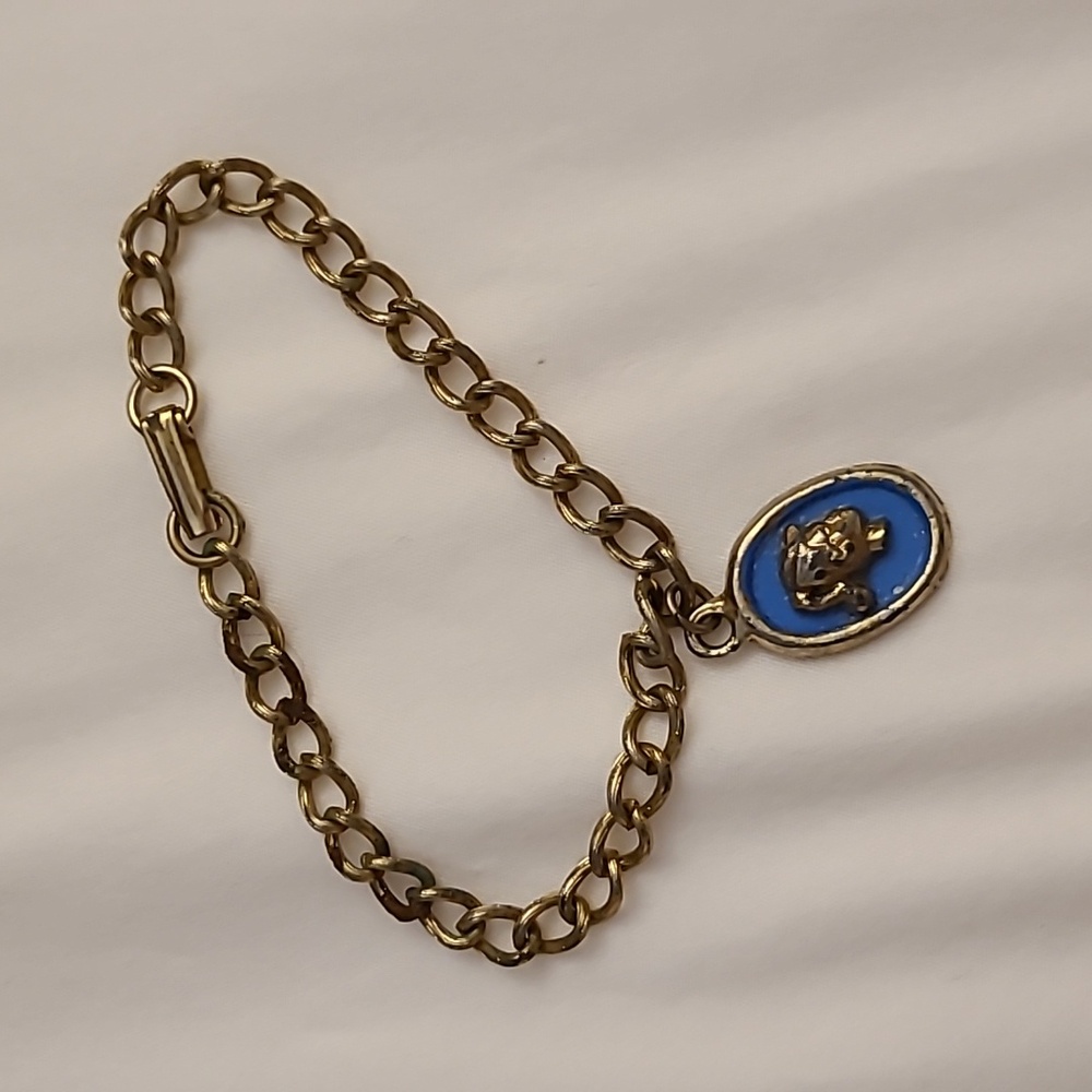 Vintage Barbie bracelet, made by Mattel in 1963. Shows signs of wear and tear.